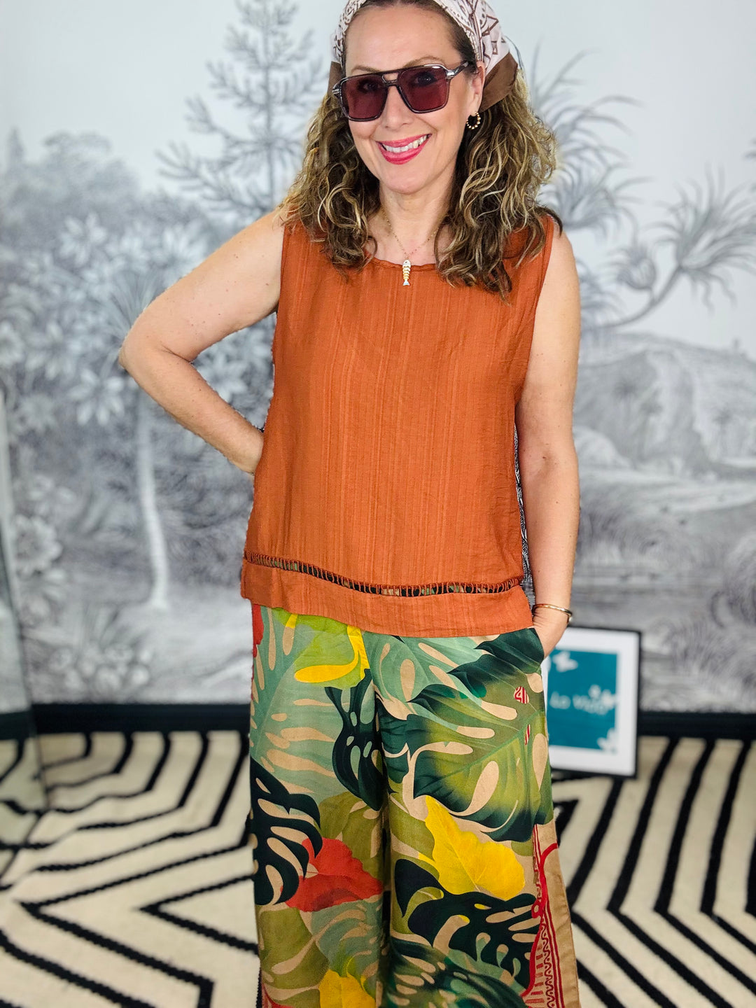 Tobago Textured Sleeveless Top with Cutout Hem